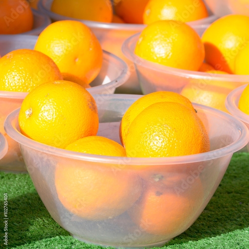 Oranges for sale in bowls at bi-weekly market in Bedford, Bedfor photo