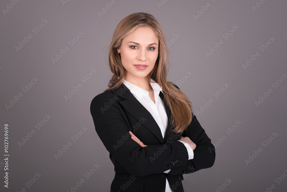 Portrait of wonderful young business woman on gray background Portrait of wonderful young business woman on gray background