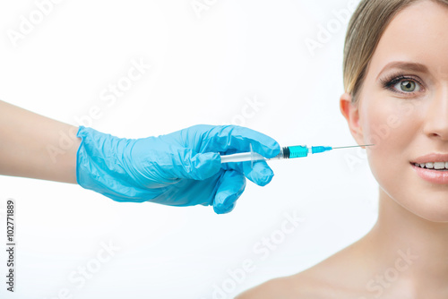 Professional cosmetologist making beauty injections 