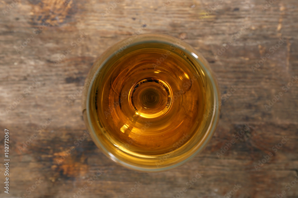 Glass of wine on wooden table. Top view Glass of wine on wooden table. Top view