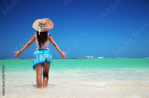 Young woman relaxing on tropical carribean beach photo