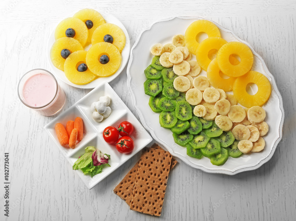 Fruits and vegetables on light wooden background. healthy eating concept. Fruits and vegetables on light wooden background. healthy eating concept.