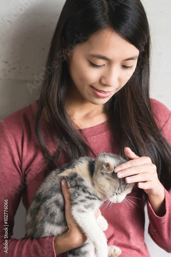  woman play with her kitten