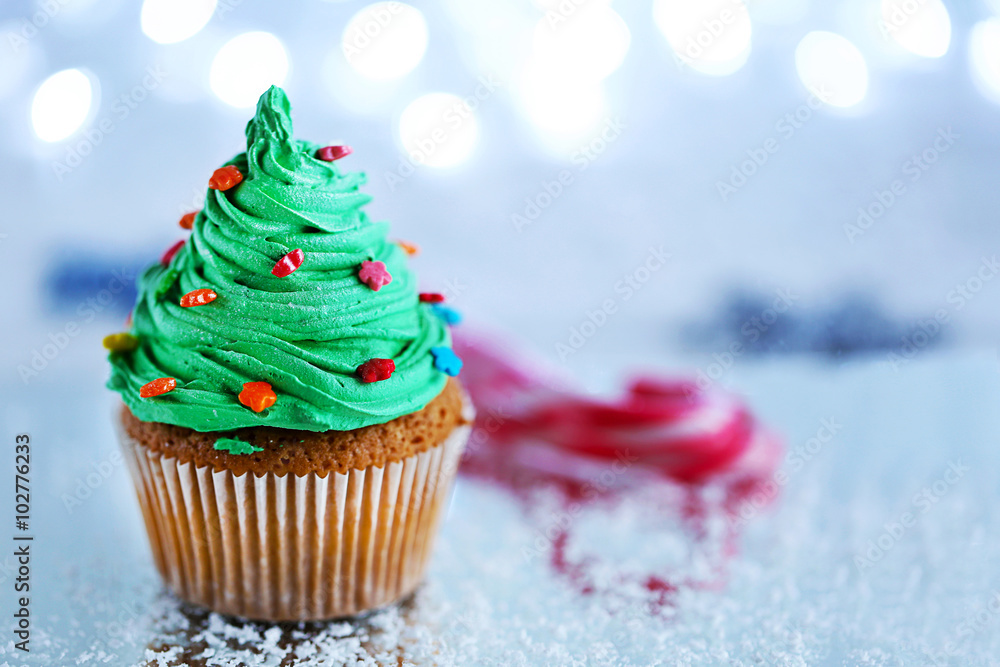 Christmas cupcake with lights on background Christmas cupcake with lights on background