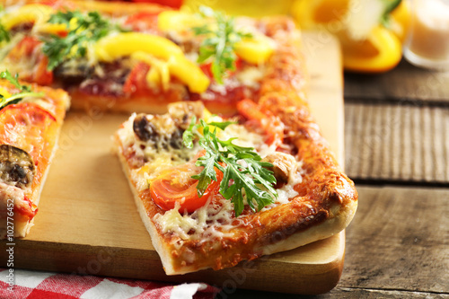 Pieces of delicious pizza on the table, close-up