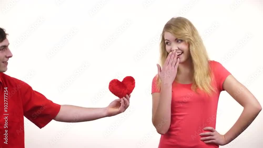Couple in love. Man giving woman red heart 4K Couple in love. Man giving woman red heart 4K