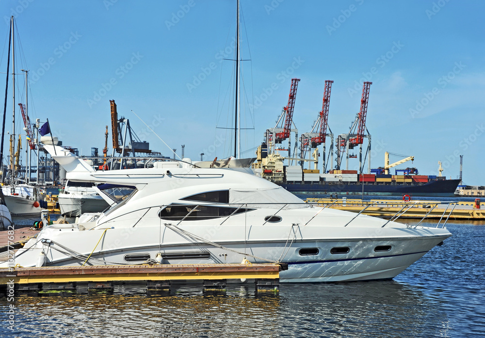 White motor yacht over harbor pier, Odessa, Ukraine