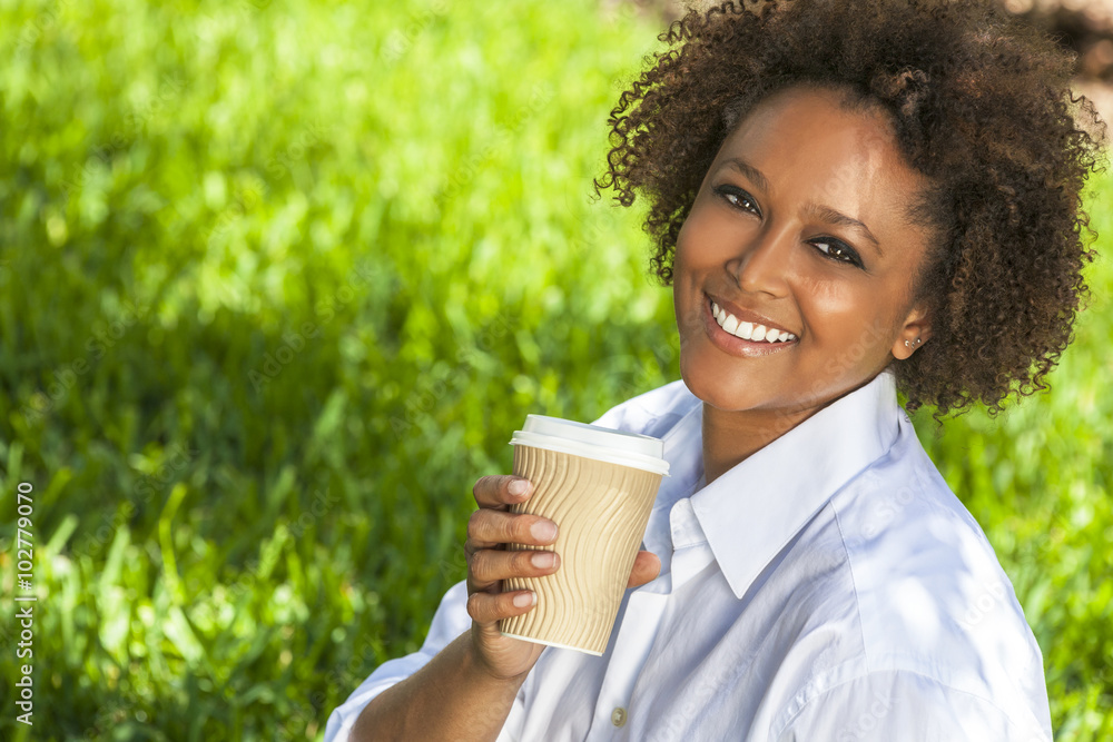 African American Woman Drinking Coffee Outside African American Woman Drinking Coffee Outside