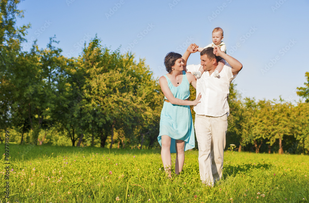 Human Relationships Concepts. Young Caucasian Family of Three People Outdoors