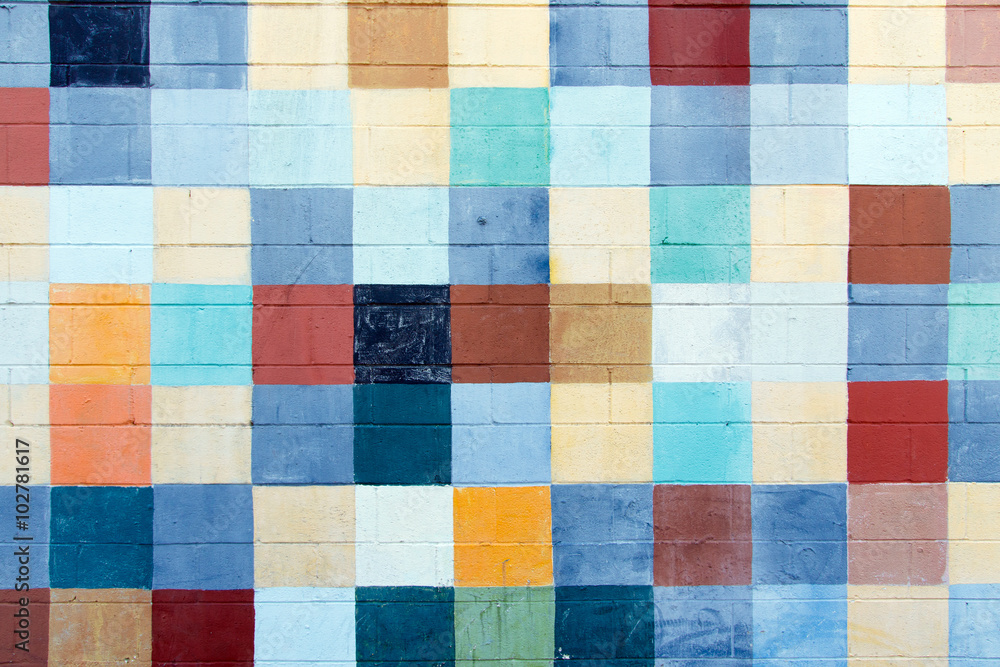 Color DSLR abstract stock image of multi-colored squares painted on cinder blocks