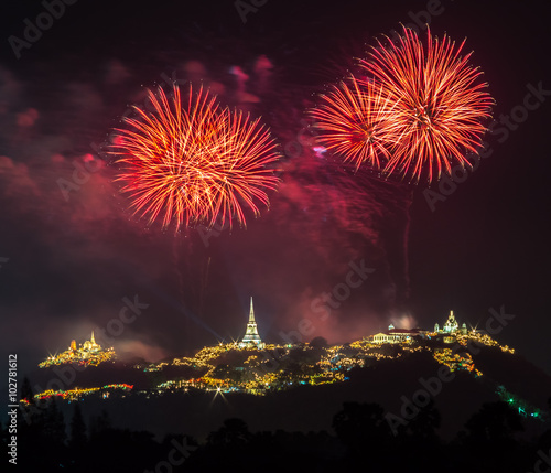 Fireworks show at night with pagoda foreground