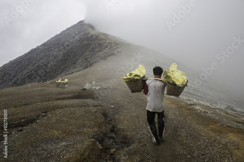 People mining sulfur at kawah ijen. It worth Rp.650 per kilogram.  Photo by Yudhistira Dharma photo