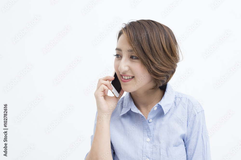 Women are having a conversation on a mobile phone happily Women are having a conversation on a mobile phone happily