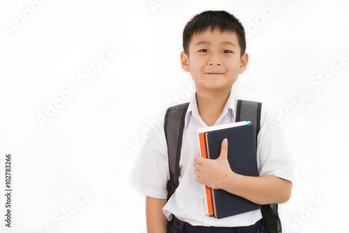 Asian Little School Boy Holding Books with Backpack