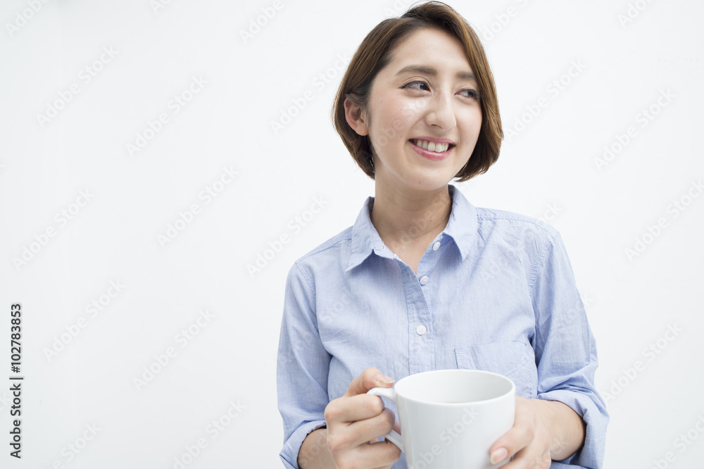 Woman smiling with a white mug Woman smiling with a white mug