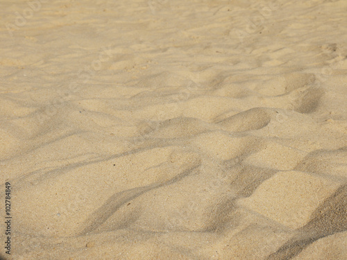 closeup of sand pattern of a beach in the summer