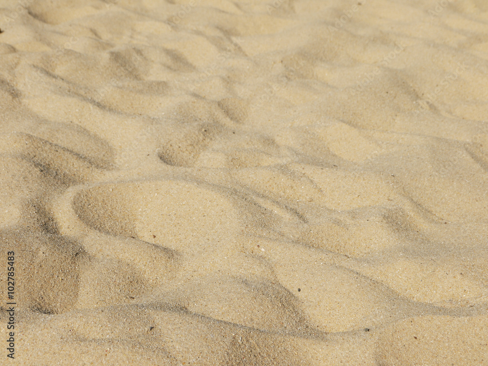 closeup of sand pattern of a beach in the summer closeup of sand pattern of a beach in the summer