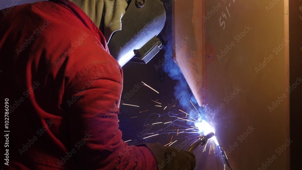 workers welding metal parts in big modern shipyard
workers welding metal parts in big modern shipyard