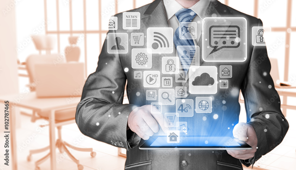 Business man using tablet PC with social media icon set Business man using tablet PC with social media icon set
