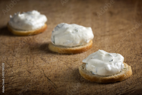 Golden crackers with cream cheese