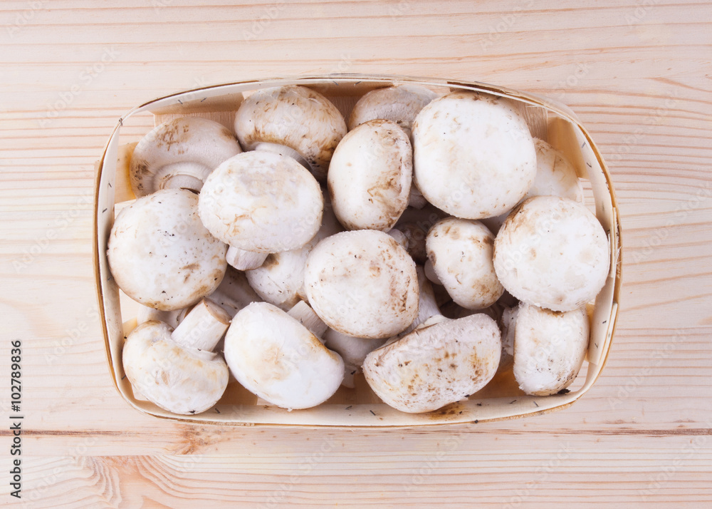 Fresh mushrooms on wooden table.