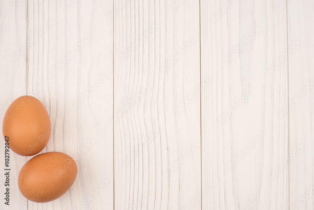 Beautiful chicken eggs on white old wooden table Beautiful chicken eggs on white old wooden table