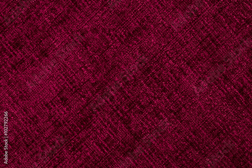 Closeup detail of red fabric texture background. © Dmytro Holbai