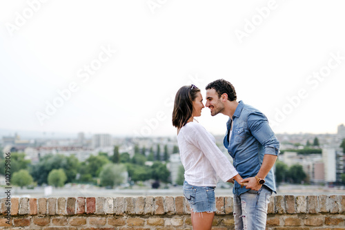Couple in love being close to each other outdoors