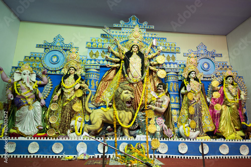 MUMBAI, INDIA - October 20, 2015: An idol of revered goddess Durga standing in the temporary temple in the city of Mumbai during Durga Puja festival celebration.