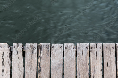 wood jetty floor on running river