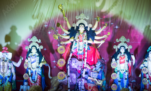 MUMBAI, INDIA - October 20, 2015: An idol of revered goddess Durga standing in the temporary temple in the city of Mumbai during Durga Puja festival celebration.