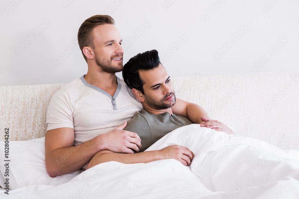 Asleep gay couple lying in bed Asleep gay couple lying in bed