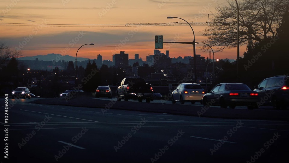 Cars Passing On City Road At Dusk Cars Passing On City Road At Dusk