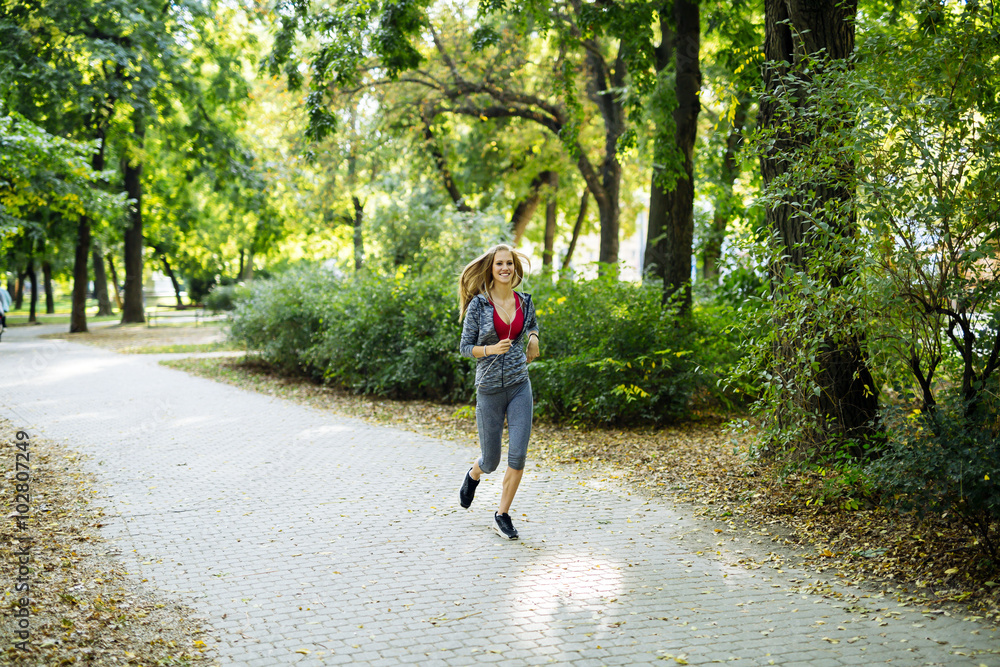 Fototapeta premium Young blonde woman jogging