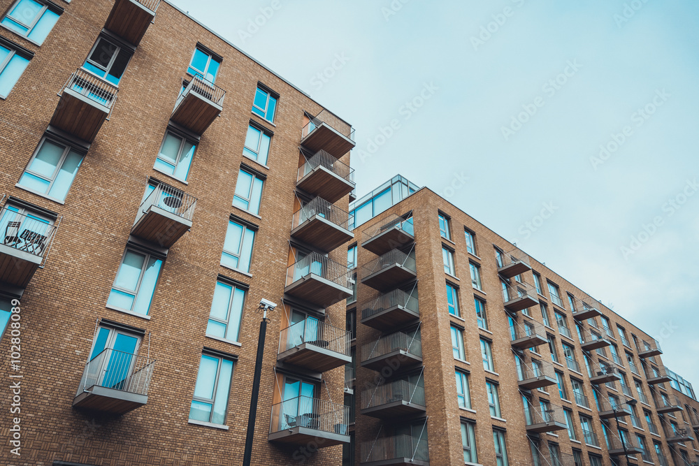 Modern brick apartment buildings with balconies