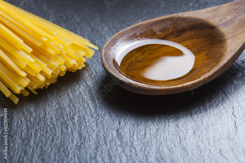 italian food mediterranean cooking pasta still life different kinds of pasta cheese and olive oil photo