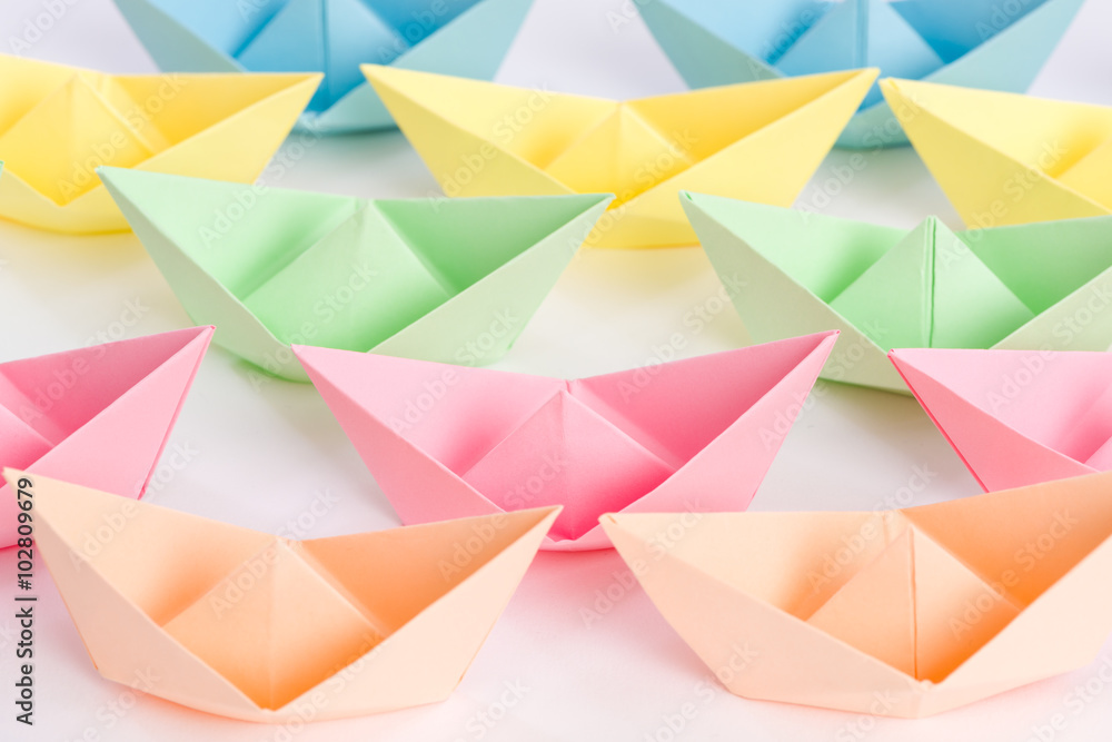 Fleet of origami paper ships passing by Fleet of origami paper ships passing by