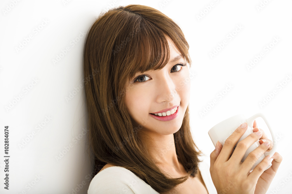 young Woman drinking hot latte coffee in living room young Woman drinking hot latte coffee in living room
