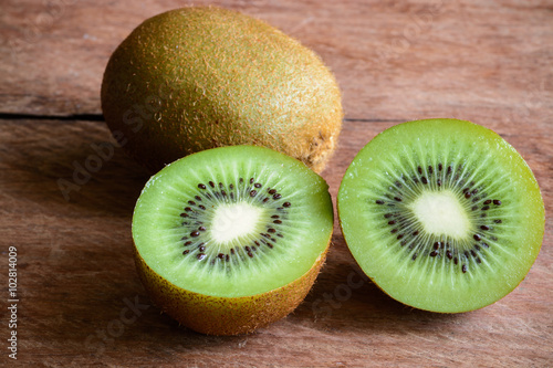 Fresh kiwi fruits on wooden background