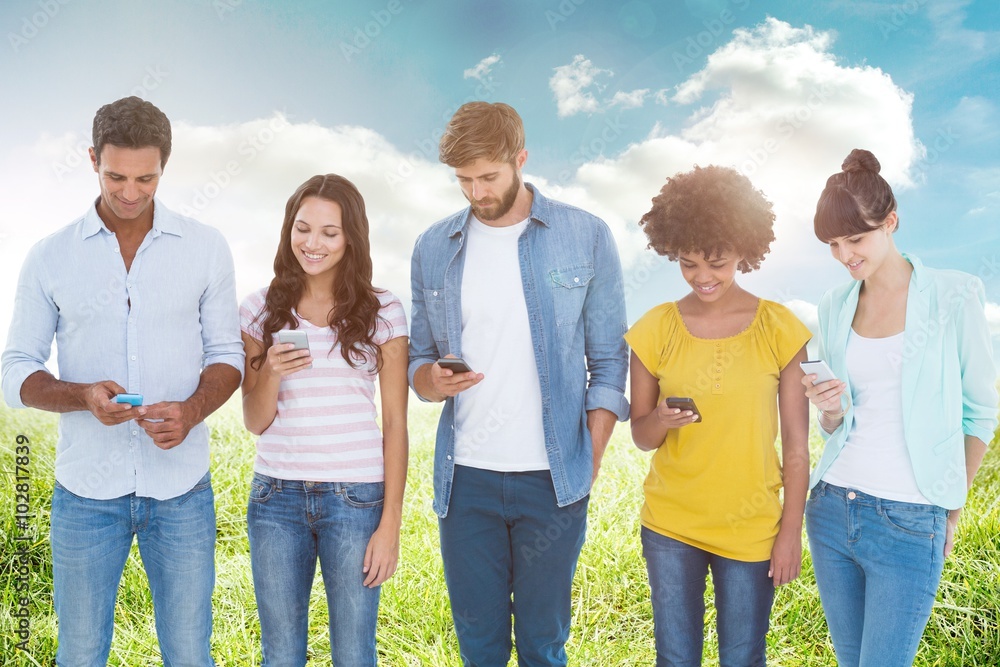 Composite image of creative colleagues with mobile Composite image of creative colleagues with mobile