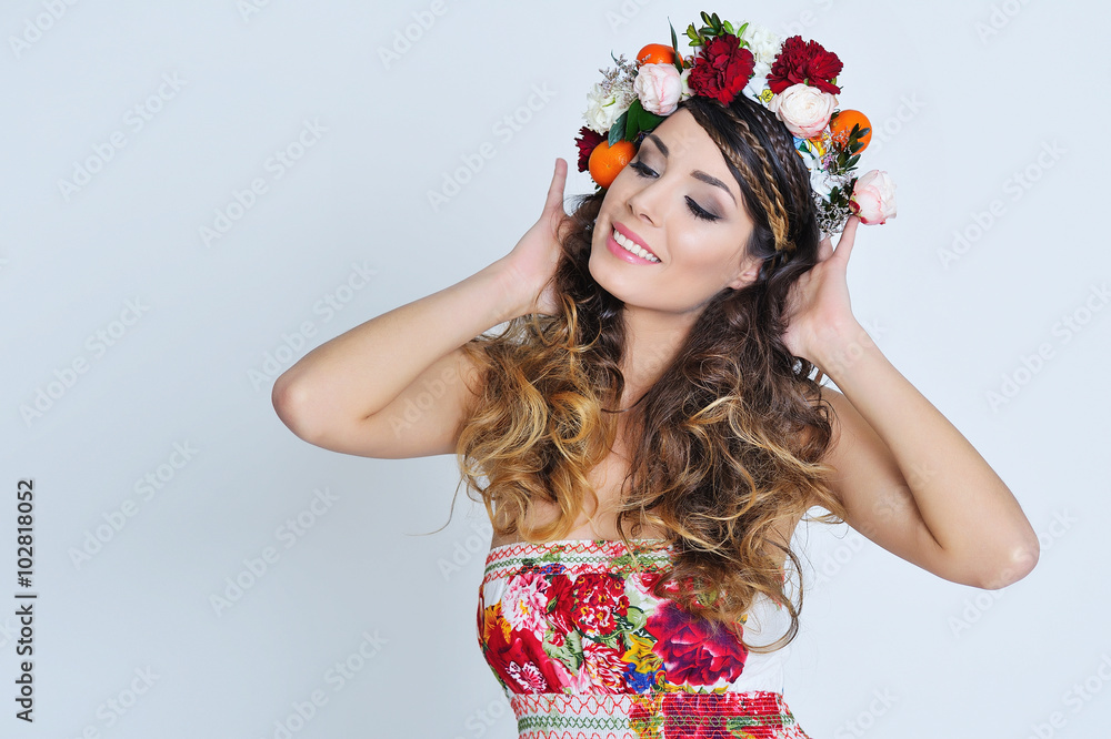 Beauty portrait of a gorgeous woman with gipsy hairstyle wearing flower  crown and fancy dress with floral print Stock Photo | Adobe Stock