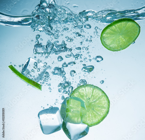 Limes with water splash and...