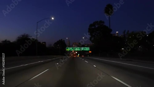 Downtown Los Angeles 101 and 110 Freeway interchange night moving shot.