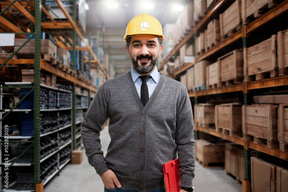 Young businessman in warehouse Young businessman in warehouse