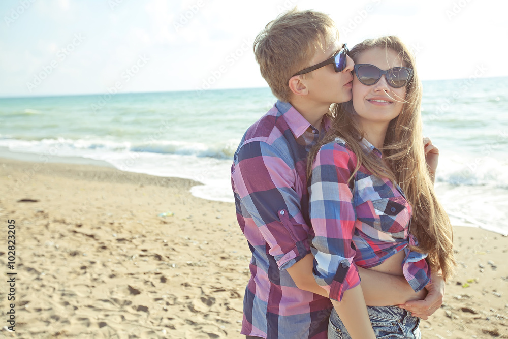 Happy pair walking on the beach Happy pair walking on the beach