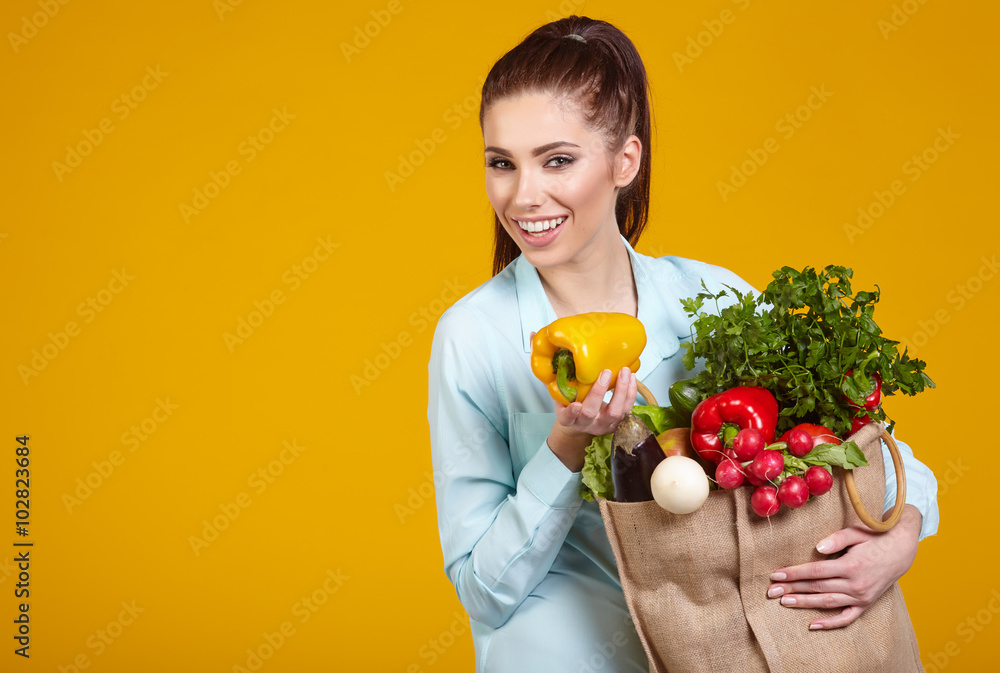 beautiful young woman with fruits and vegetables in shopping bag beautiful young woman with fruits and vegetables in shopping bag