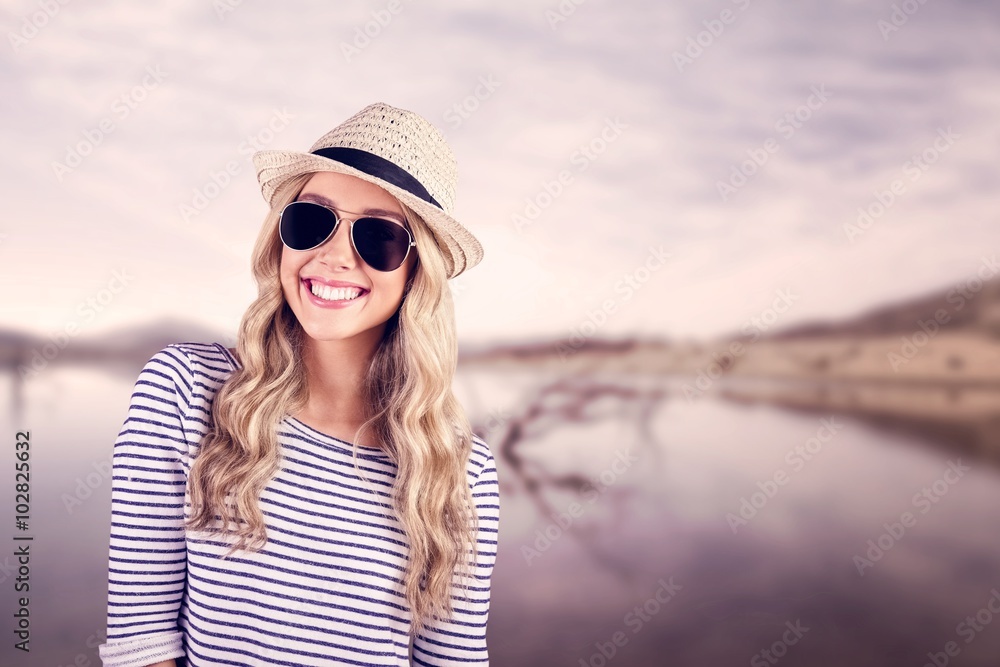 Gorgeous smiling blonde hipster with sunglasses and straw hat Gorgeous smiling blonde hipster with sunglasses and straw hat