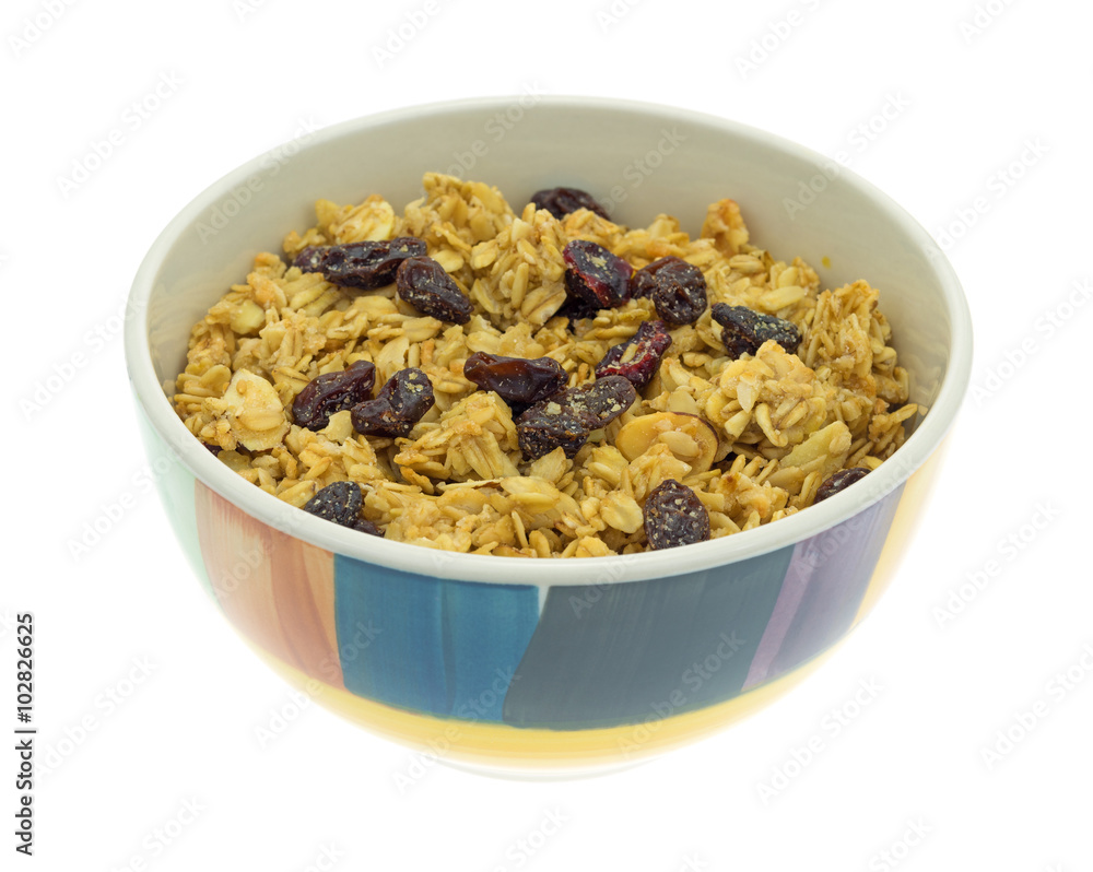 Side view of granola cereal in a colorful bowl isolated on a white background Side view of granola cereal in a colorful bowl isolated on a white background