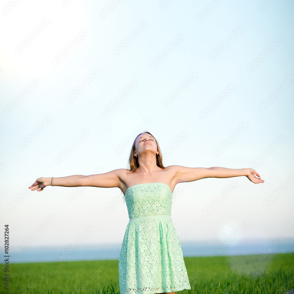 Happiness woman stay outdoor under sunlight of sunset Happiness woman stay outdoor under sunlight of sunset