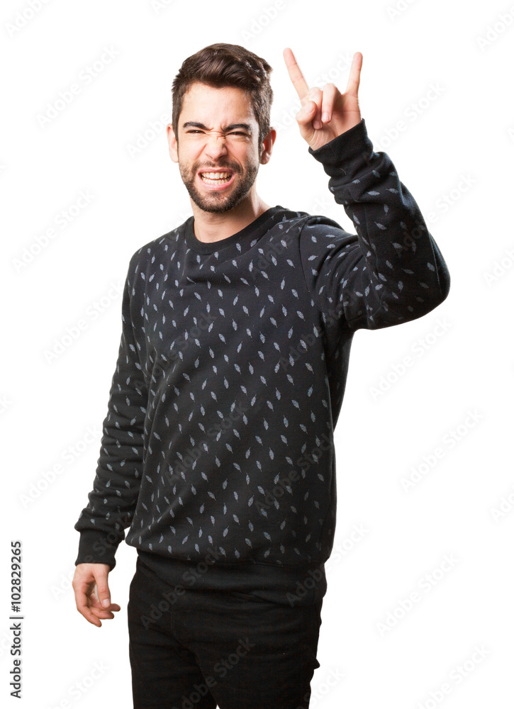 Fototapeta premium young man doing a rock symbol